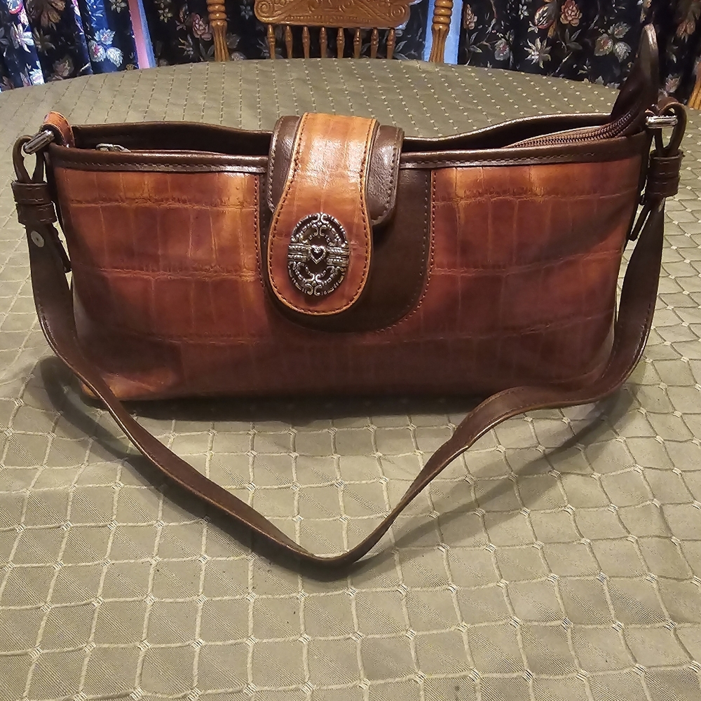 M.C. leather purse. Small size. Excellent condition.  No signs of wear.